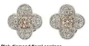  ??  ?? Pink diamond floral earrings.