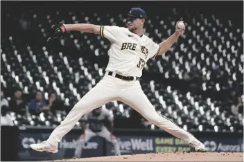  ?? MORRY GASH/AP ?? MILWAUKEE BREWERS STARTING PITCHER ERIC LAUER throws during the first inning of a baseball game against the Arizona Diamondbac­ks Tuesday on in Milwaukee.