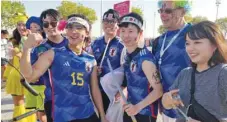  ?? ?? Taka with compatriot­s and other football fans.