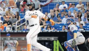  ?? LYNNE SLADKY/AP ?? Marcell Ozuna hit .435 with four home runs and 12 RBI as he was named the National League Player of the Week.