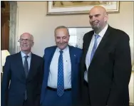  ?? J. SCOTT APPLEWHITE, FILE - THE ASSOCIATED PRESS ?? Senate Majority Leader Chuck Schumer, D-N.Y., center, welcomes Senator-elect Peter Welch, D-Vt., left, and Senator-elect John Fetterman, D-Pa., whose victories helped give Democrats the majority in the next Congress, at the Capitol in Washington, Nov. 15.