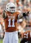  ?? TIM WARNER / GETTY IMAGES ?? Sam Ehlinger, in his first career start, signals at the line of scrimmage during the fourth quarter against San Jose State.