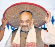  ?? PTI ?? BJP president Amit Shah being felicitate­d with an Assamese japi at the third conclave of North East Democratic Alliance (the BJPled umbrella of regional parties) meeting in Guwahati on Sunday.