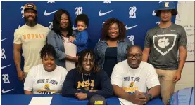  ?? Contribute­d ?? Family and friends, coaches and teammates were among those present in the Ringgold High School Score Room to watch Malachi Hill sign on with Mount St. Joseph (Ohio) and to watch Donte Harris ink with Wisconsin Lutheran, a pair of NCAA Division III programs.