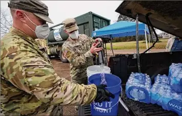  ?? Rogelio V. Solis / Associated Press ?? Army National Guard soldiers across the country have until Thursday to get the mandated COVID-19 vaccine. If the current numbers hold, there are concerns about possible impact on Guard readiness in the states, including whether it will affect Guard units preparing to deploy.