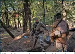  ?? ?? Ukrainian servicemen check trenches dug by Russian soldiers in Kherson