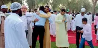  ??  ?? New Muslims greet each other at a gathering in Al Mushrif park.