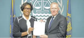  ?? ?? Permanent Representa­tive of Jamaica to the Internatio­nal Seabed Authority Alison Stone Roofe presents her credential­s to Secretary General Michael W Lodge.