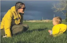  ??  ?? Kyle Paterson from Airth, Falkirk, took this picture of his wife Joanna and daugher Phoebe in a park in Airth, with the dark clouds of a spring storm in the distance.