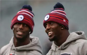  ?? NANCY LANE — BOSTON HERALD ?? Twin brothers Jason Mccourty and Devin Mccourty, right, warm up on the field before New England’s game against the Philadelph­ia Eagles at Lincoln Financial Field on Nov. 17, 2019. Devin Mccourty, who recently retired, thanked fans for their support.