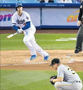  ?? Mark J. Terrill Associated Press ?? DODGERS ROOKIE Cody Bellinger watches his two-run home run in the first inning against Chad Kuhl of the Pittsburgh Pirates, foreground.