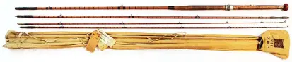  ?? ?? > A 15’ vintage Hardy Bros Ltd. “Palakona” three section split cane float fishing rod, est. £70-90