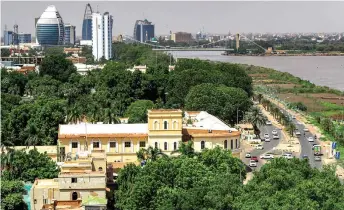  ?? AFP photo ?? A view of the skyline of Sudan’s capital Khartoum by the Blue Nile river and the Tuti bridge connecting the city with the nearby Tuti island, at the confluence of the White and Blue Nile branches. —