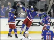  ?? BILL KOSTROUN — THE ASSOCIATED PRESS ?? New York Rangers right wing Rick Nash (61) celebrates his goal with defenseman Marc Staal (18) and right wing Mats Zuccarello (36) during the third period of Friday’s game against the Los Angeles Kings at Madison Square Garden in New York.