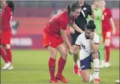  ?? FERNANDO VERGARA — THE ASSOCIATED PRESS ?? Canada’s Vanessa Gilles, left, comforts the United States’ Carli Lloyd after Monday’s soccer semifinal.