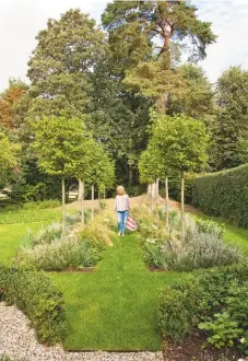  ??  ?? EXTERIOR Alexandra added box hedging and replaced a wobbly bridge over the garden brook. Toulston dining chairs, £240 each, Neptune. Oak garden bench, £375, Somerlap