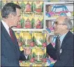  ?? THE ASSOCIATED PRESS ?? In this Jan. 7, 1992, photo, President George H. Bush, left, listens to Toys R Us Chairman Charles Lazarus during an event tomark the chain’s second store to open in Japan. Lazarus, founder of Toys R Us, died Thursday.