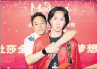  ?? PROVIDED TO CHINA DAILY ?? Beyond’s former bassist, Wong Ka-keung (left) with his brother Wong Ka-kui’s wax replica in Madame Tussauds Beijing.