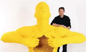 ?? ?? Lego artist Nathan Sawaya with his sculpture Big Yellow. Sawaya’s show The Art of the Brick has opened in Melbourne. Photograph: Mitchell Haddad