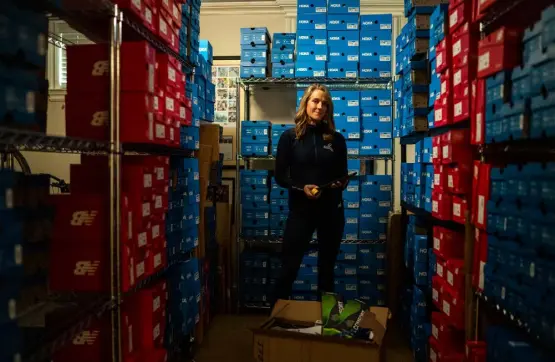  ?? Christophe­r Capozziell­o, © The New York Times Co. ?? Megan Searfoss, the owner of two running stores, at her new storage facility in Ridgefield, Conn., on Nov. 4. After watching supply chain concerns in Vietnam mount this summer and into the fall, Searfoss secured the new facility and has been stockpilin­g sneakers.