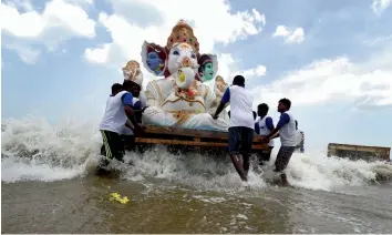  ?? — PTI ?? Devotees immerse Lord Ganesha’s idol in the Bay of Bengal near Chennai after the end of Ganesh Utsav on Thursday.