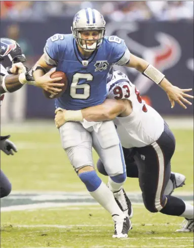  ?? David J. Phillip / Associated Press ?? Quarterbac­k Dan Orlovsky, then with the Lions, is sacked by Tim Bulman of the Texans in a game on Oct. 19, 2008. Orlovsky, a former star at UConn and Shelton High, retired after a 12-year career in the NFL.