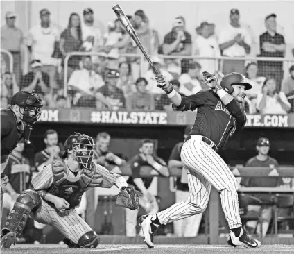  ?? JAMES PUGH, AP ?? Arizona’s Cesar Salazar watches his game-winning hit in the 11th inning against Mississipp­i State.