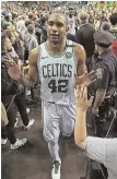  ?? STAFF PHOTO BY MATT STONE ?? PLAYOFF PAYOFF: Al Horford celebrates with fans on the way off the Garden floor after eliminatin­g the 76ers Wednesday night.