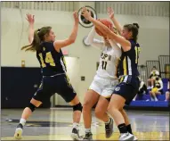  ?? AUSTIN HERTZOG - MEDIANEWS GROUP ?? Pope John Paul II’s Amelia Kennedy, center, tries to split Upper Perk defenders Bailey Cahill (14) and Gabby Neal (15) Tuesday.