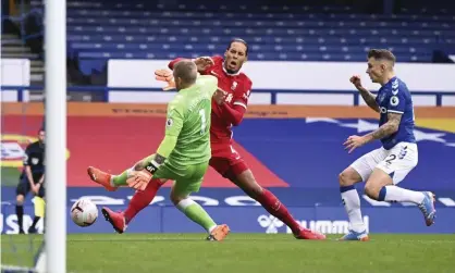  ??  ?? Virgil van Dijk is tackled and injured by Jordan Pickford in the Merseyside derby on Saturday. Photograph: Laurence Griffiths/AP