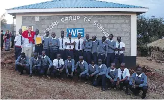  ??  ?? Ottawa’s Mitch Kurylowicz poses with the first class of students at Ngulot Secondary School in Kenya.