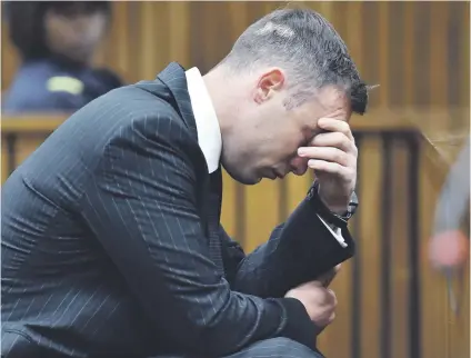 ?? Pictures: EPA-EFE, Gallo ?? BROKEN. Paralympia­n Oscar Pistorius sits in the dock for his sentencing hearing at the High Court in Pretoria last year. His jail sentence was increased to 13 years and five months yesterday.