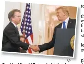  ?? AP ?? President Donald Trump shakes hands with Judge Brett Kavanaugh.