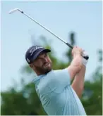  ?? AP PHOTO/ GERALD HERBERT ?? Wyndham Clark hits off the 9th tee Friday during the second round of the PGA Zurich Classic golf tournament at TPC Louisiana in Avondale, La.