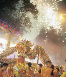  ?? STRAW Heritage Portal MARK ?? DRAGON Dance and fireworks at the Chinese New Year celebratio­ns in Cyrildene.