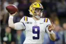  ?? GERALD HERBERT — THE ASSOCIATED PRESS ?? LSU quarterbac­k Joe Burrow passes against Clemson during the second half of a NCAA College Football Playoff national championsh­ip game Monday in New Orleans.