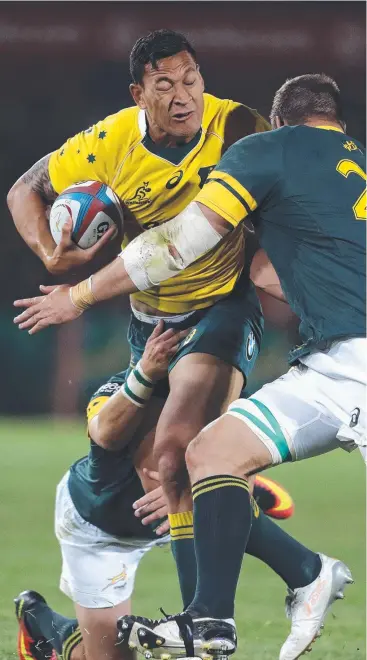  ?? Picture: AP ?? THWARTED: Israel Folau is tackled by South Africa’s Willem Alberts (right) and Morne Steyn during the Rugby Championsh­ip match in Pretoria.