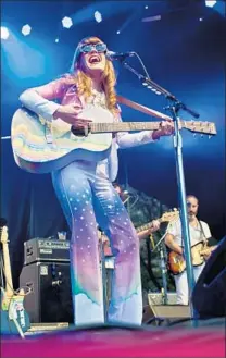  ?? Timothy Hiatt
WireImage ?? JENNY LEWIS , seen in 2014, on her “graffiti Gram Parsons suit”: “It makes me feel like a lady version of Willy Wonka.”