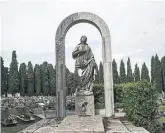  ?? NADIA SHIRA COHEN/THE NEW YORK TIMES ?? A sculpture stands as a marker at a tomb in the cemetery of San Michele, the city’s isle of the dead.