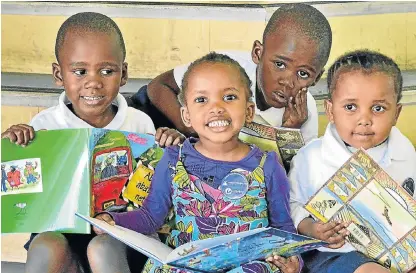  ?? /Ivor Markman ?? Early start: Preschoole­rs Sibabalwe, Lisakhanya, Linamandla and Sibusisiwe at the KwaMagxaki library in Port Elizabeth. Once at school, most children in SA do not receive mother tongue education.