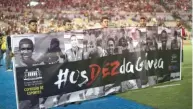  ??  ?? GETTY IMAGES Flamengo supporters hold up a poster, in honor of the 10 youth academy players that died in a dormitory fire, before a Carioca Serie A match against Fluminense at the Maracanã stadium in Rio, Brazil, on February 14, 2019.