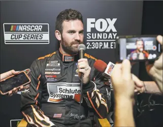  ?? John Raoux / Associated Press ?? Corey LaJoie answers questions during an interview at NASCAR Daytona 500 auto racing media day at Daytona Internatio­nal Speedway on Wednesday in Daytona Beach, Fla.