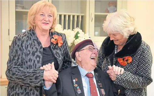  ?? Photograph by Paul Glendell ?? PRESENTATI­ON: Sandy Cortmann, 97, enjoys his big day with his two nieces Irene Campbell and Pat Duthie.