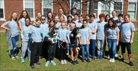  ?? PHOTO PROVIDED ?? A look at the 2018East Greenbush Central School District Superinten­dent’s Student Advisory Council with two Peppertree Rescue dogs, Nacho and Empanada, who were rescued from Puerto Rico following last year’s hurricane.