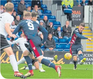  ??  ?? Josh Mullin’s left-footed strike gives County a two-goal advantage