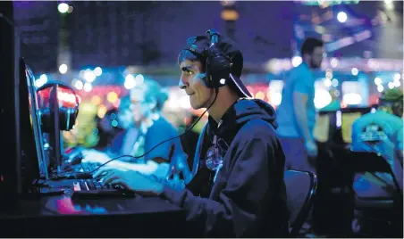  ?? THE ASSOCIATED PRESS ?? An attendee plays the video game World of Warcraft at a gaming conference in California. The World Health Organizati­on said Monday that compulsive gaming constitute­s a new mental-health condition.