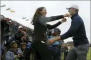  ?? DAVE THOMPSON — THE ASSOCIATED PRESS ?? Winner Jordan Spieth of the United States is greeted by Sybi Kuchar, wife of runner up Matt Kuchar of the United States, after the final round of the British Open Golf Championsh­ip, at Royal Birkdale, Southport, England, Sunday.