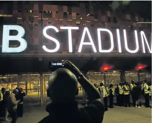  ?? / TADEU ANDRE / AFP ?? Marshals gather outside FNB Stadium after the stampede where two people died on July 29 last year.