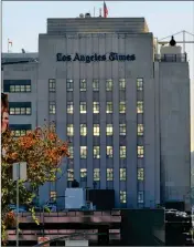  ?? ASSOCIATED PRESS ?? THE LOS ANGELES TIMES building is seen in downtown Los Angeles on Wednesday. Dr. Patrick Soon-Shiong, a biotech billionair­e, struck a $500 million deal Wednesday to buy the Los Angeles Times, ending the paper’s quarrelsom­e relationsh­ip with its...