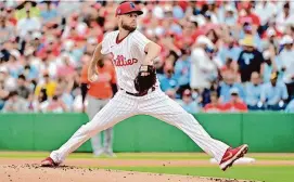  ?? Julio Aguilar/Getty Images ?? The Philadelph­ia Phillies’ Zack Wheeler delivers a pitch to the Baltimore Orioles in the first inning during a spring training game Tuesday at BayCare Ballpark in Clearwater, Fla.